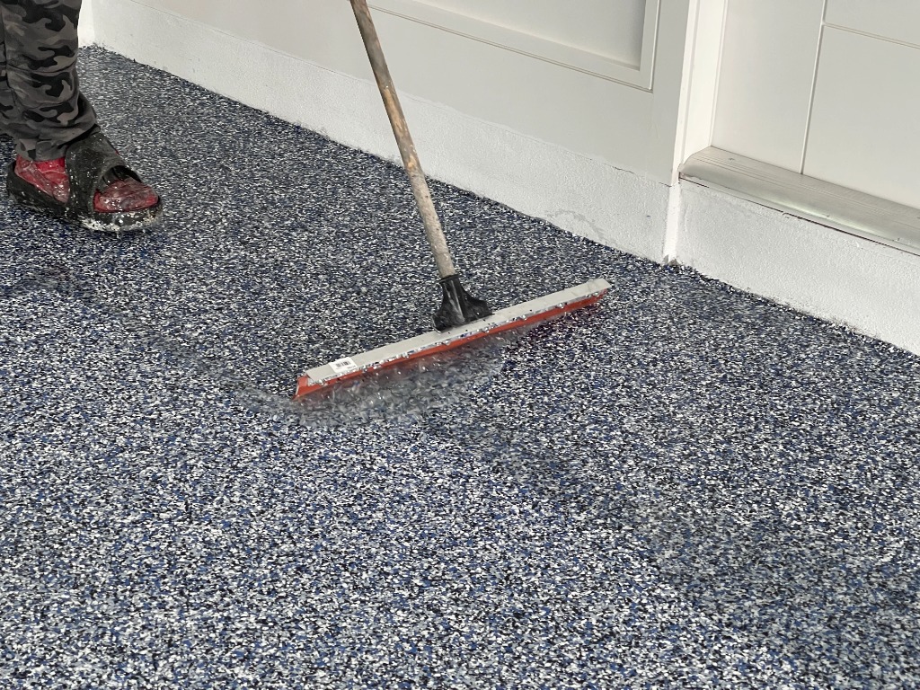 TrueBond Floor Coatings crew installing a premium flake floor coating